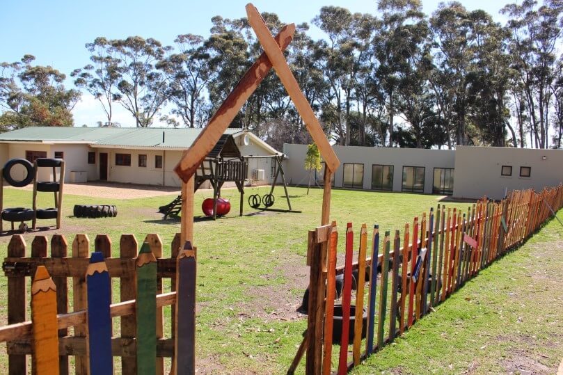 Ambition International School peaceful farm campus with playground and outdoor learning spaces